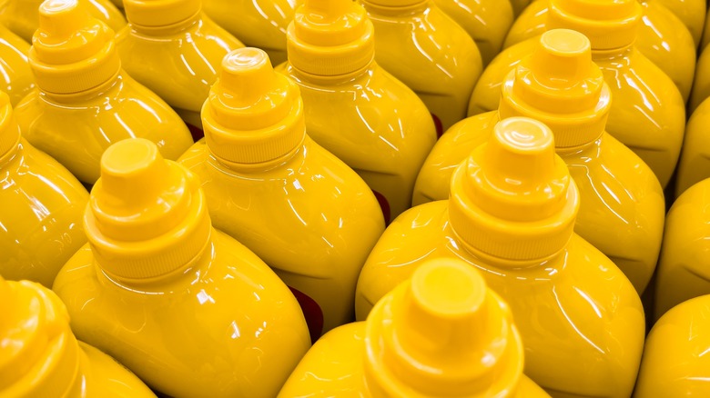 tops of yellow mustard bottles