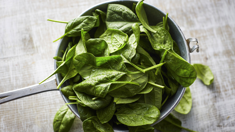 a bunch of fresh spinach in a pot