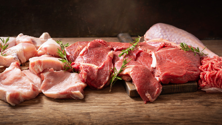 Different meat types on cutting board