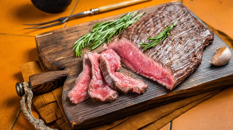 Flank steak on cutting board