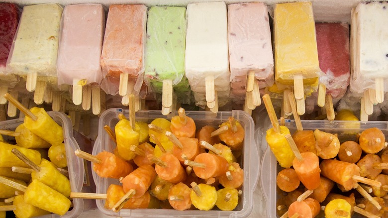 Overview of an icebox full of fruit Popsicles