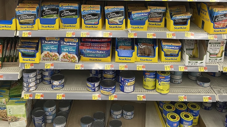 supermarket aisle with canned and pouched tuna