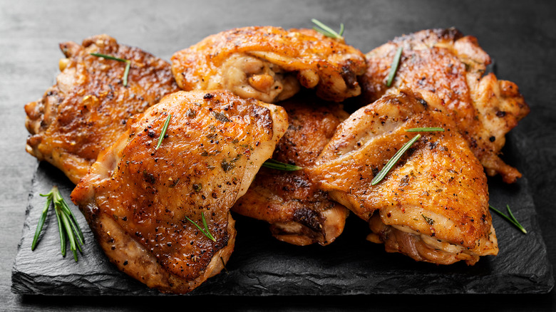 Chicken thighs topped with rosemary