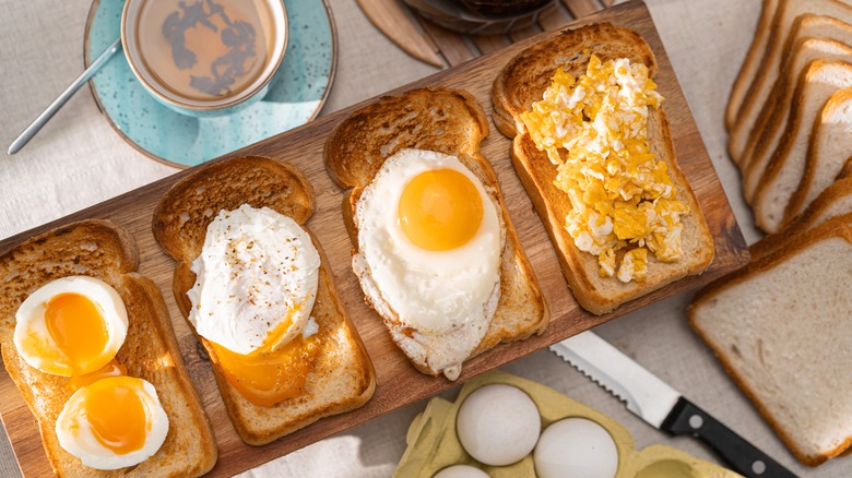 Toast board with boiled, poached, fried, and scrambled eggs