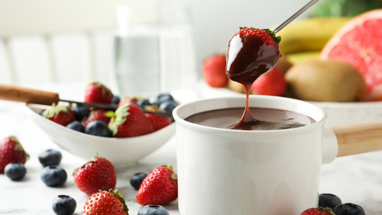 Fondue with chocolate and strawberries