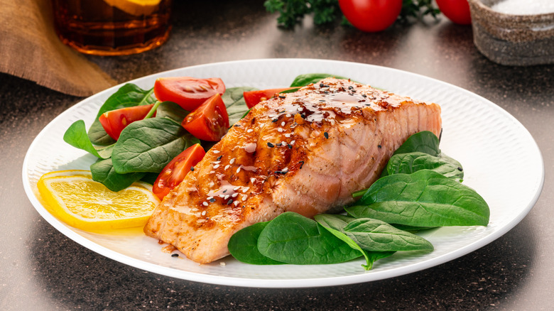 salmon on a bed of vegetables