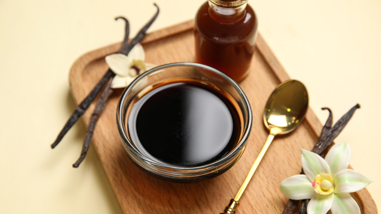 vanilla extract in a bottle and a bowl