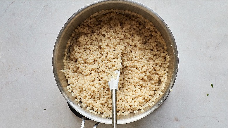 cooking couscous in a saucepan