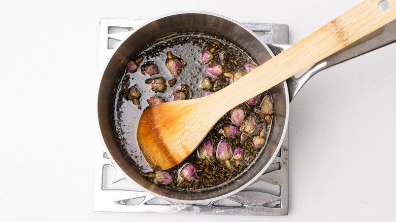 floral syrup cooling in saucepan