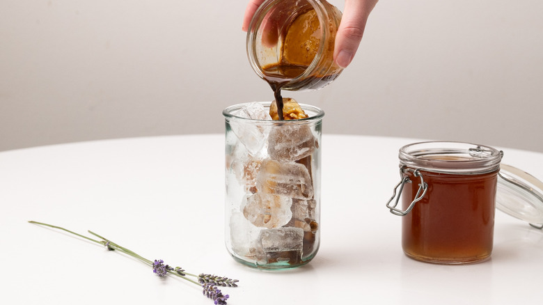 pouring espresso into a glass