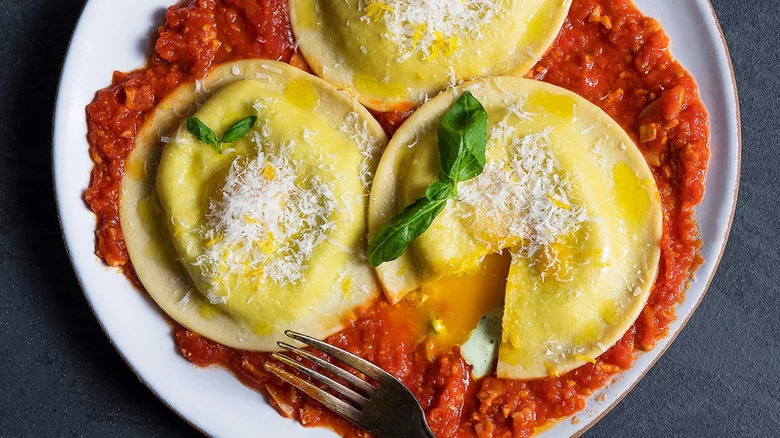 ravioli with egg and sauce