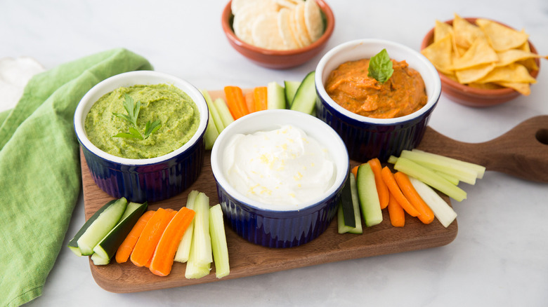 colorful dipping sauces on board