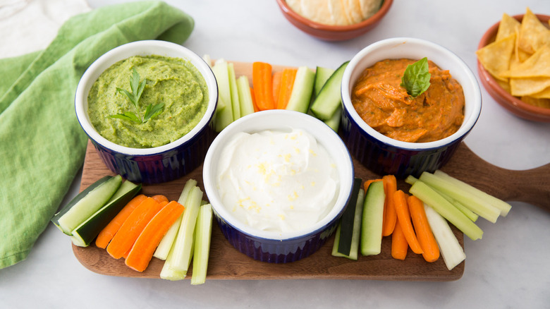 colorful dipping sauces on board