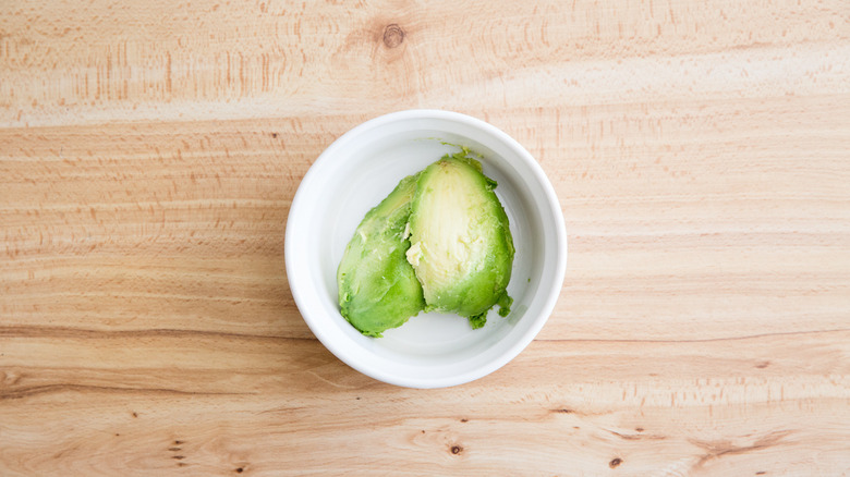 avocado flesh in white bowl