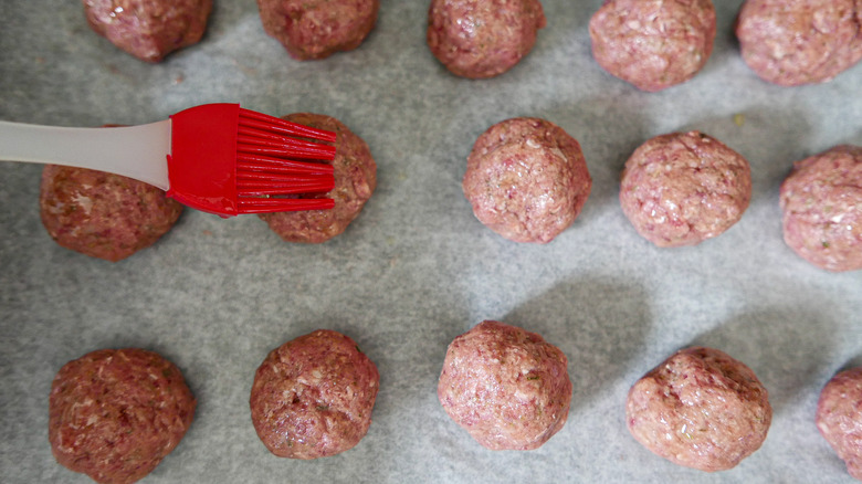 rolled meatballs on pan