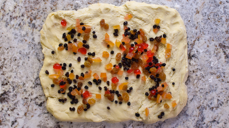 dough on countertop with fruits