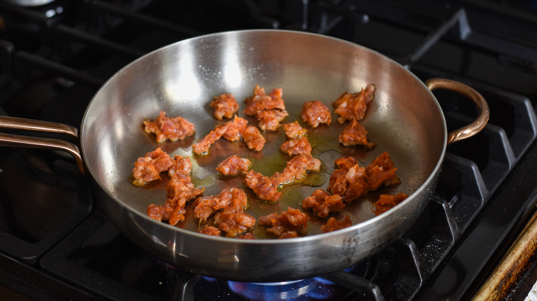 sausage cooking in pan