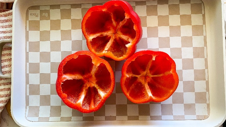 3 cut red peppers on baking tray