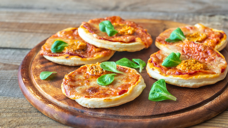 Pizzettas on wooden plate