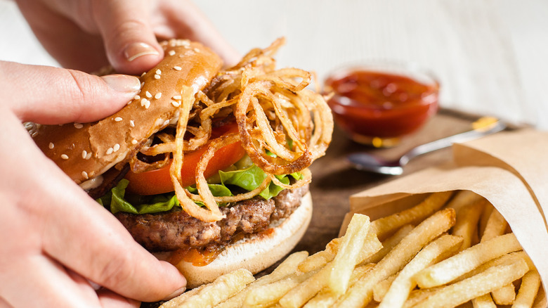 Hamburger with crispy onions and fries