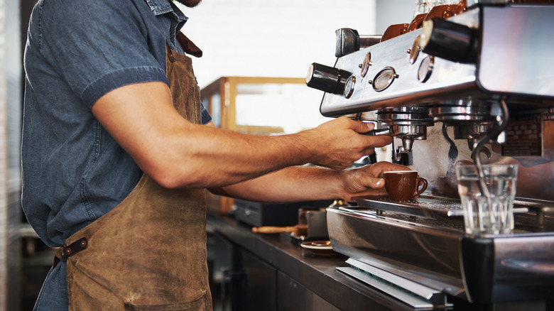 barista making coffee