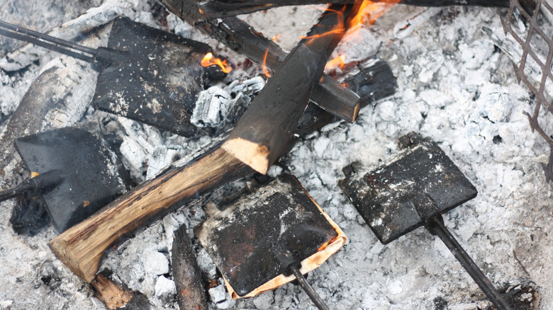 Pie irons in campfire