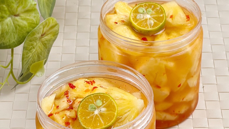 Two jars of pickled pineapple