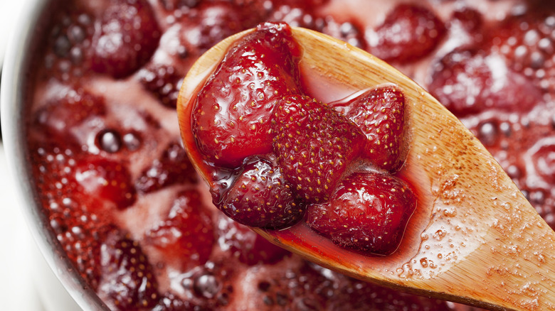 spoon with simmering strawberries