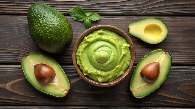 Halved avocados and avocado sauce