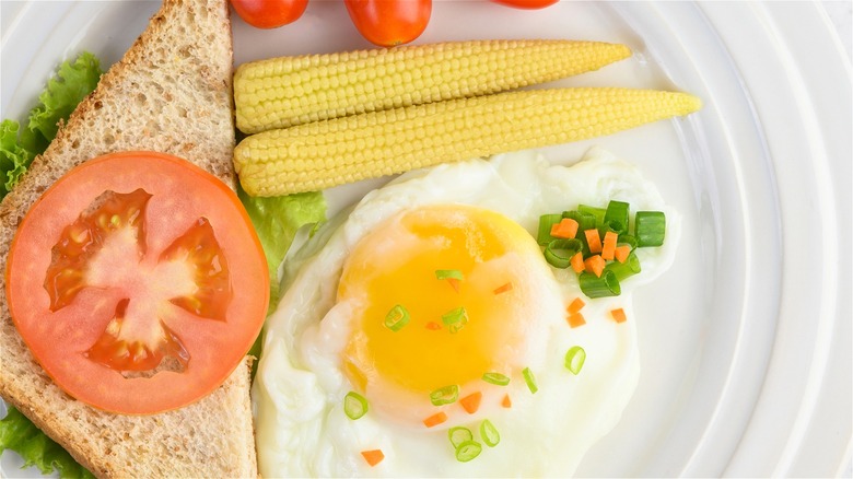 Eggs, toast and baby corn