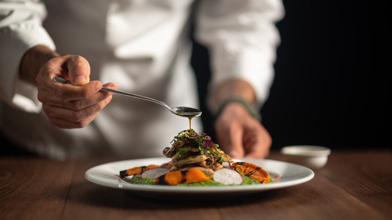 Chef plating food