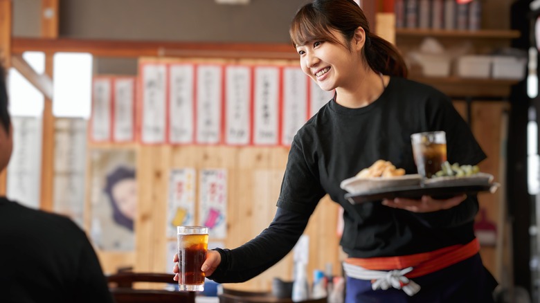 woman server at an izakaya