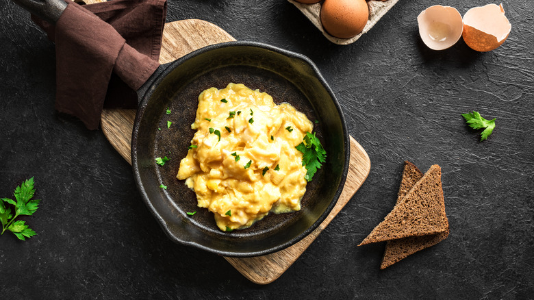 cooked scrambled eggs in skillet