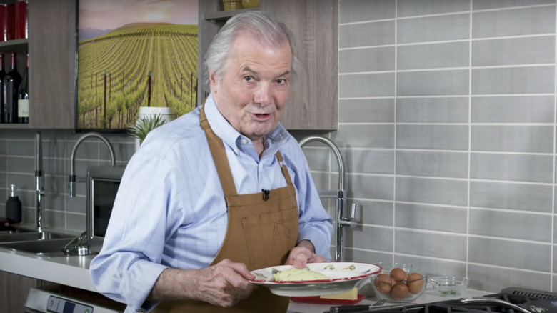 Jacques Pepin holding omelet