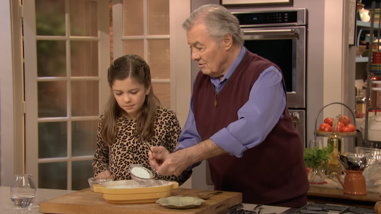 Jacques Pepin with his granddaughter