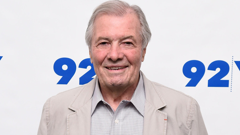 jacques pepin smiles in button up and coat