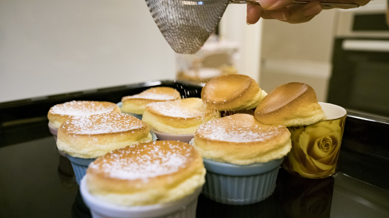 garnishing soufflé with sugar