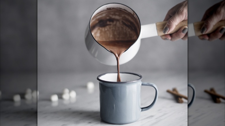 hot chocolate pouring into mug