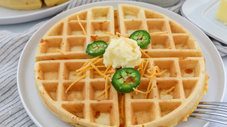 a cooked jalapeño cheddar waffle on a plate