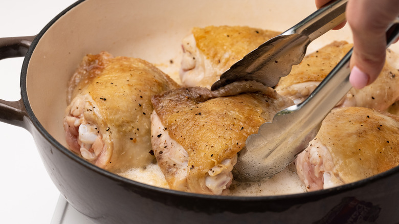 Browning chicken in a pan