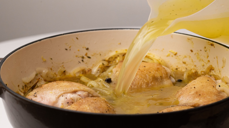 Pouring stock into pan