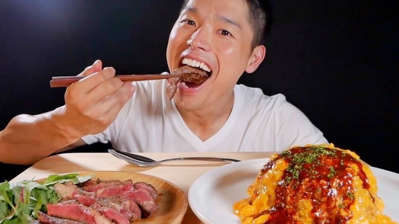 Bayashi eating steak and omurice