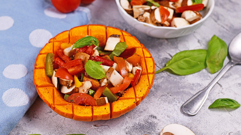 salad served in red kuri squash