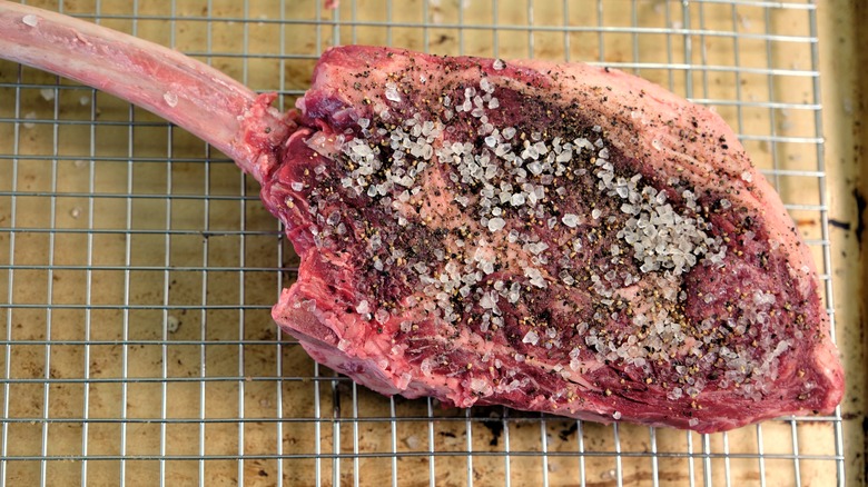 Tomahawk steak on a wire rack