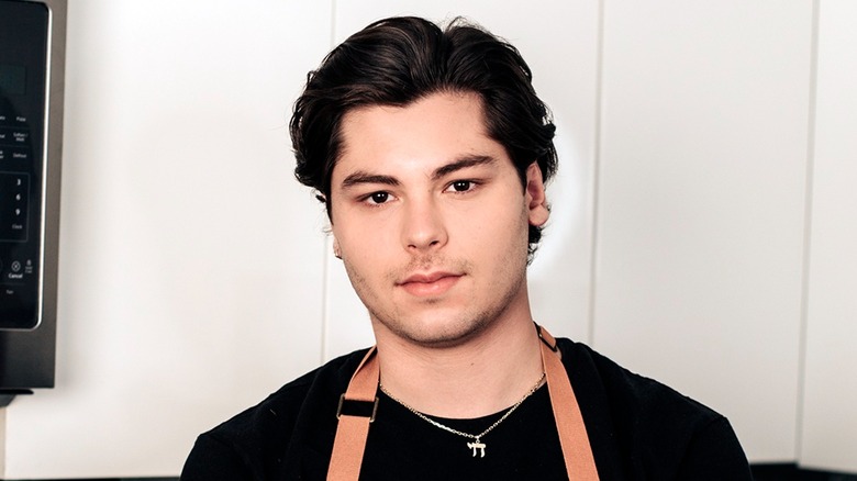 Jeremy Scheck posing in kitchen