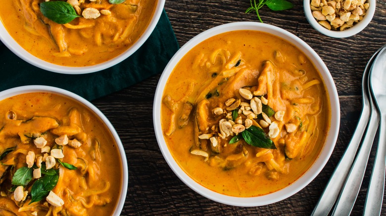 Thai curry pumpkin soup with peanut garnish