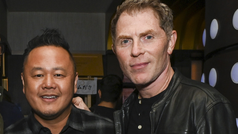 Jet Tila and Bobby Flay posing at event