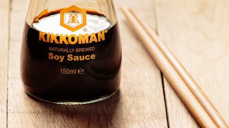 bottle of soy sauce and chopsticks