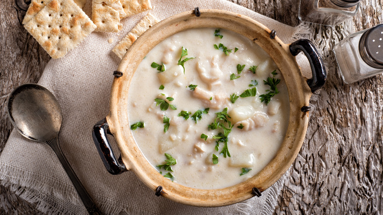 chowder in bowl with haddock and crackers