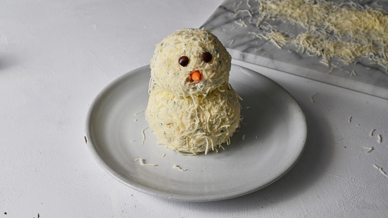 snowman cheese ball on plate